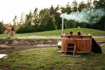 Фото номера Дом с 1 спальней Дома для отпуска Jūrkalnes Meža SPA г. Ošvalki 14